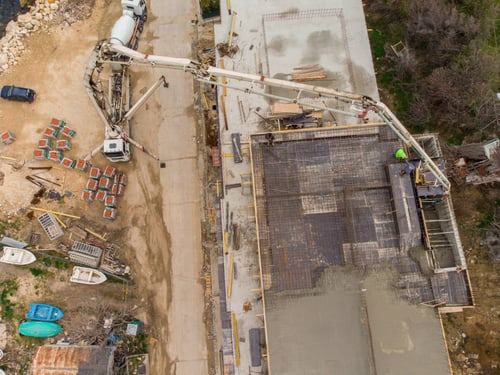 Aerial view of an active construction site protected by Security Perú Services