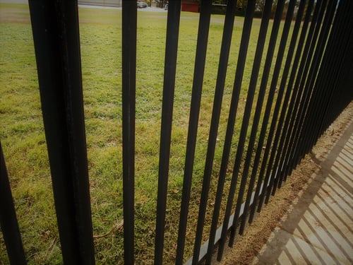 Secured perimeter fence at a protected property